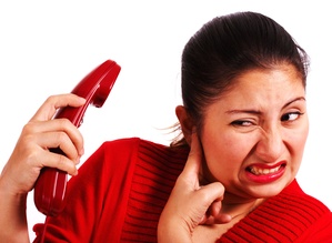 Woman Stressed Listening To A Loud Complaint