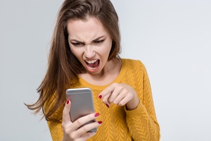 angry woman screaming on the phone because of annoying social network